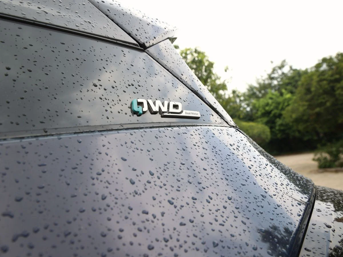 tata harrier ev qwd quad wheel drive dual motors car photography in rain aryan