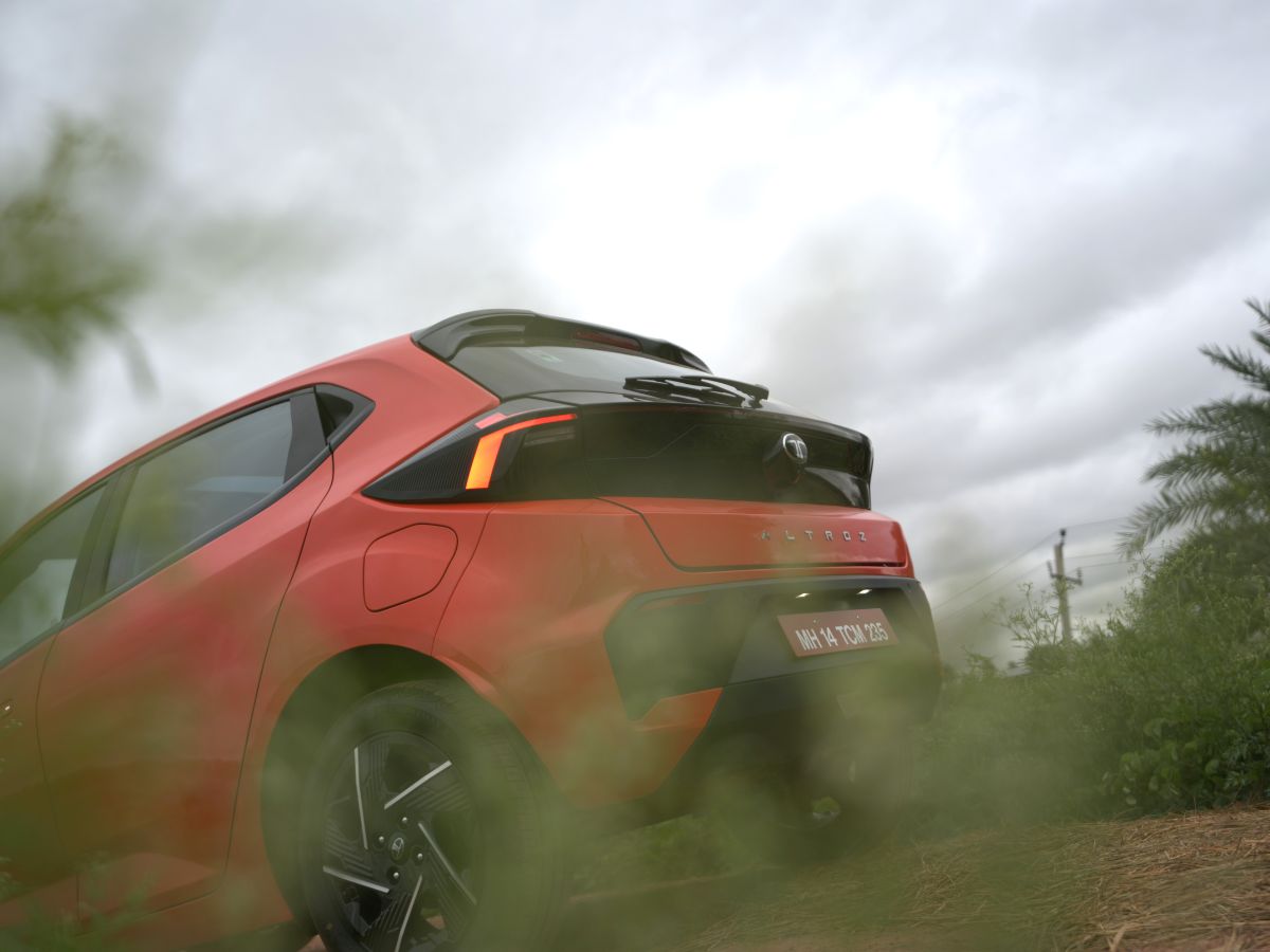 cars-and-plants-photography-new-tata-altroz-ember-red-and-green-grass-bangalore-aryan.jpg